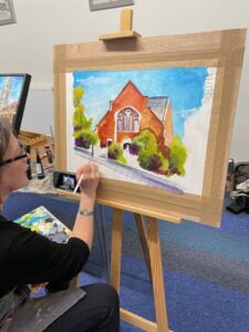 Artist Allie Whelan painting live at Baby Art Society Demonstration